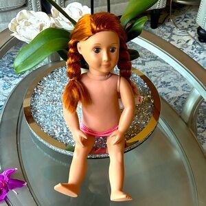 Our Generation doll.  Red hair hazel eyes has freckles.